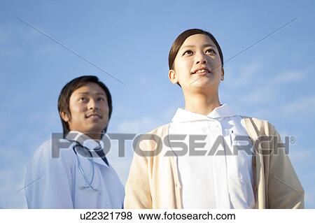 Male Doctor and Femlae Nurse View Large Photo Image Stock Photo - Male Doctor and Femlae Nurse. Fotosearch