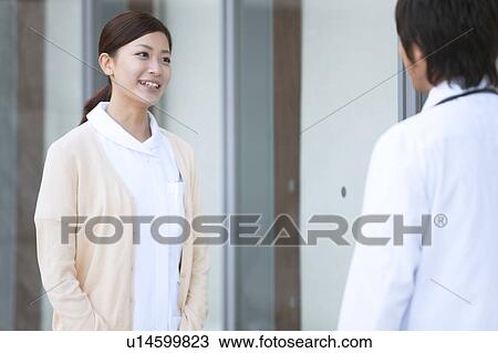 Male Doctor and Femlae Nurse Talking View Large Photo Image Stock Image - Male Doctor and Femlae Nurse Talking. Fotosearch