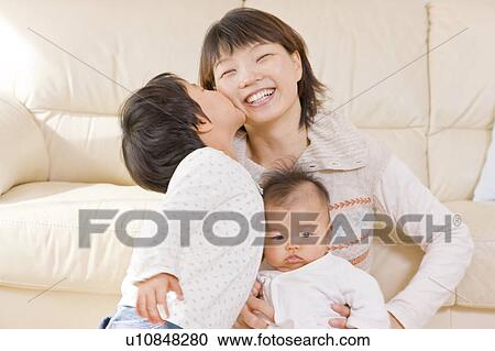 Mother and kids smiling View Large Photo Image Stock Image - Mother and kids smiling. Fotosearch