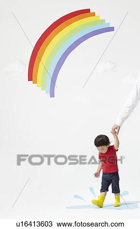 Stock Image - Mother and Son Under Rainbow. Fotosearch