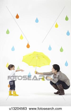 Mother Giving Umbrella to Little Boy View Large Photo Image Stock Image - Mother Giving Umbrella to Little Boy. Fotosearch