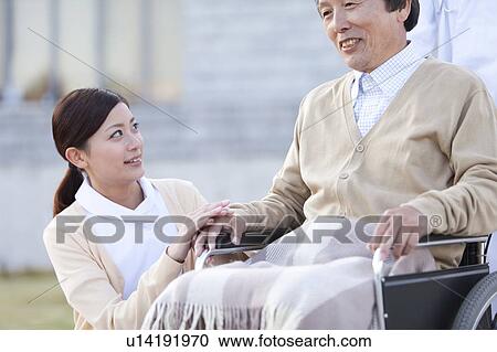 Stock Image - Nurse and Male Patient. Fotosearch
