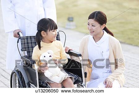 Nurse, Doctor and Girl in Wheelchair View Large Photo Image Stock Image - Nurse, Doctor and Girl in Wheelchair. Fotosearch