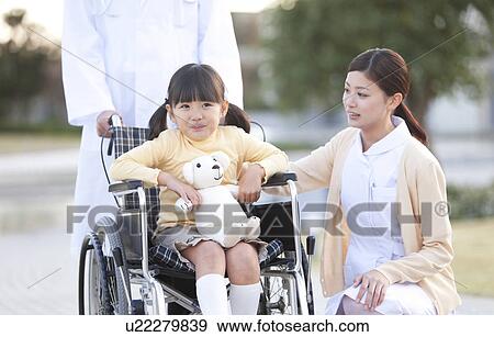 Nurse, Doctor and Girl in Wheelchair View Large Photo Image Stock Photo - Nurse, Doctor and Girl in Wheelchair. Fotosearch