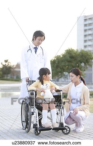 Nurse, Doctor and Girl in Wheelchair View Large Photo Image Stock Photo - Nurse, Doctor and Girl in Wheelchair. Fotosearch