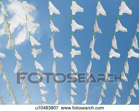 Polo shirts hung out to dry View Large Photo Image Stock Photo - Polo shirts hung out to dry. Fotosearch