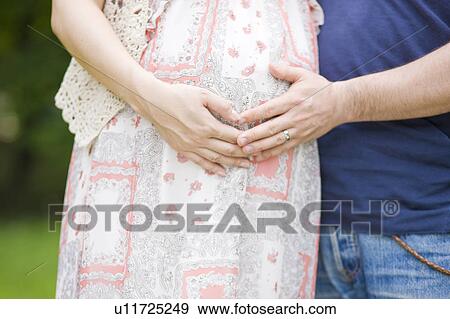 Pregnant Woman and Husband View Large Photo Image Stock Photo - Pregnant Woman and Husband. Fotosearch