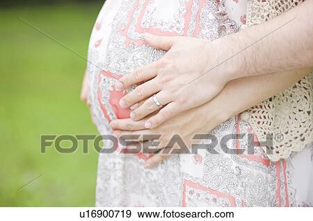 Stock Photo - Pregnant Woman and Husband. Fotosearch