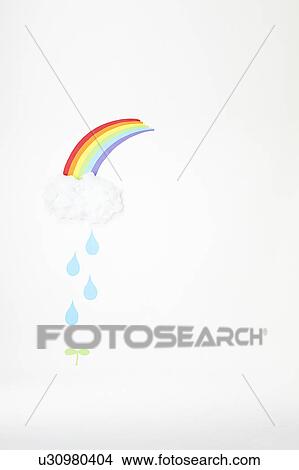 Rain From Rainbow Falling on Plant View Large Photo Image Picture - Rain From Rainbow Falling on Plant. Fotosearch