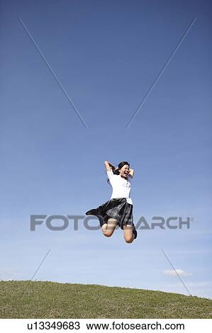 Stock Image - Schoolgirl Jumping. Fotosearch
