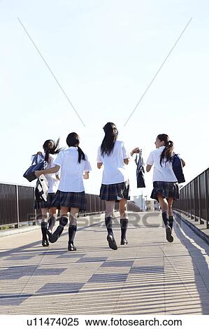 Stock Photography - Schoolgirls on Bridge. Fotosearch