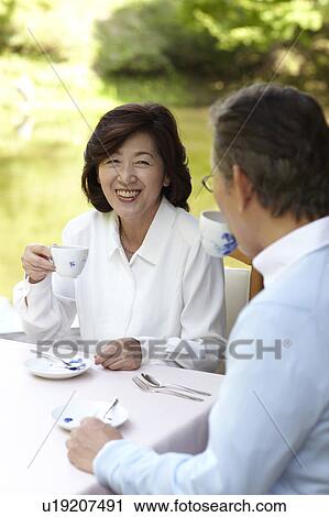 Stock Image - Senior Couple Having Afternoon Tea. Fotosearch
