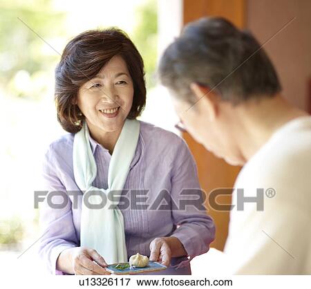 Stock Photo - Senior Couple Having Kuri Kinton. Fotosearch