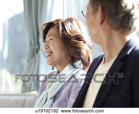 Stock Image - Senior Couple on Train. Fotosearch