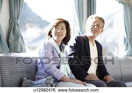 Stock Photograph - Senior Couple on Train. Fotosearch