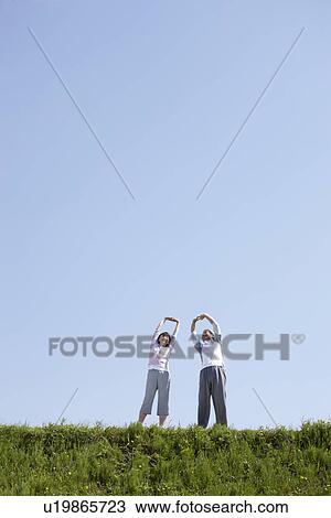 Stock Image - Senior Couple Stretching. Fotosearch