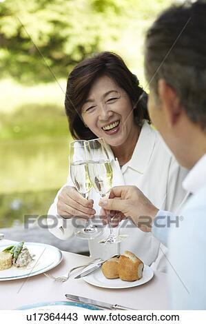 Senior Couple Toasting With Champagne View Large Photo Image Stock Image - Senior Couple Toasting With Champagne. Fotosearch