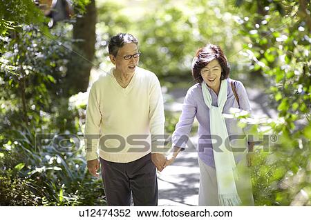 Senior Couple Walking and Talking on Path View Large Photo Image Stock Image - Senior Couple Walking and Talking on Path. Fotosearch