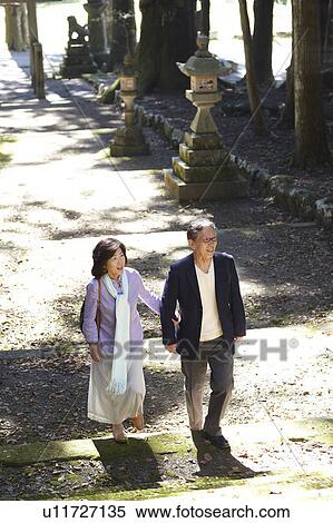 Senior Couple Walking in Park View Large Photo Image Stock Photography - Senior Couple Walking in Park. Fotosearch
