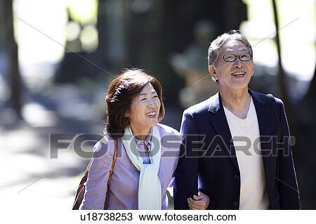 Stock Image - Senior Couple Walking. Fotosearch