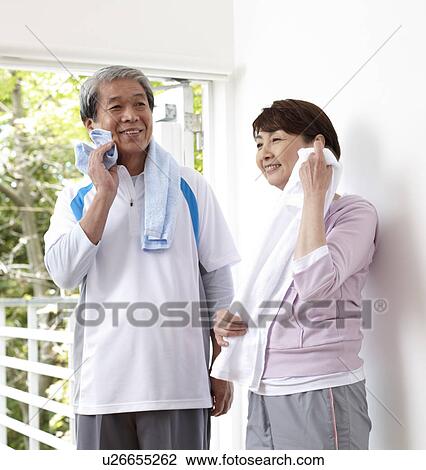 Stock Image - Senior Couple wiping After Exercising. Fotosearch