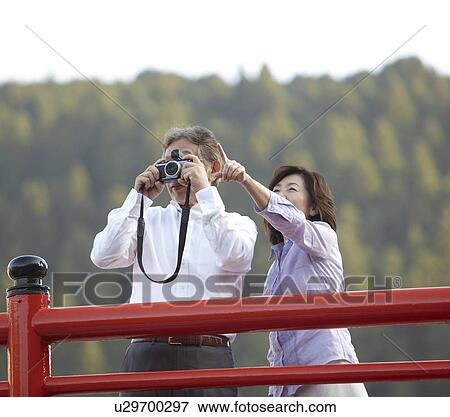 Stock Photo - Senior Couple with Camera. Fotosearch