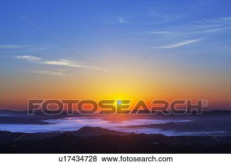 Stock Photo - Sunrise Over Mountains. Fotosearch