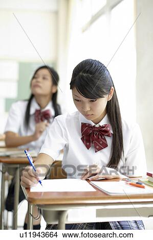 Picture - Teenage Girl in Classroom. Fotosearch