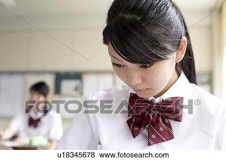 Stock Photo - Teenage Girl in Classroom. Fotosearch