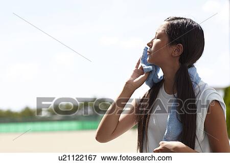 Teenage Girl Wiping Her Face View Large Photo Image Stock Photo - Teenage Girl Wiping Her Face. Fotosearch
