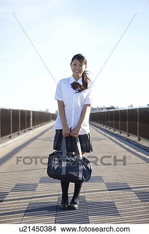 Teenage Schoolgirl on Bridge View Large Photo Image Picture - Teenage Schoolgirl on Bridge. Fotosearch