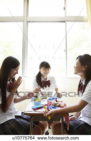 Picture - Three Female Students Having Lunch. Fotosearch