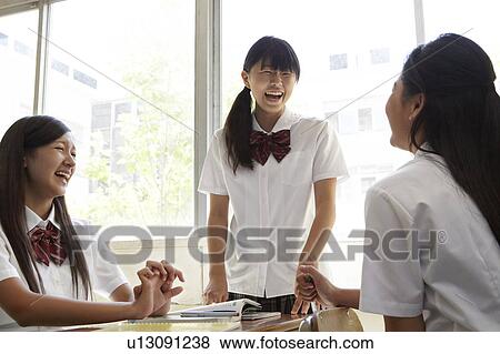 Stock Photo - Three Female Students Talking. Fotosearch