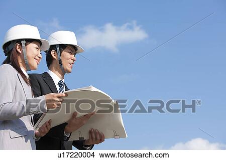 Two Businesspeople at Construction Site View Large Photo Image Picture - Two Businesspeople at Construction Site. Fotosearch