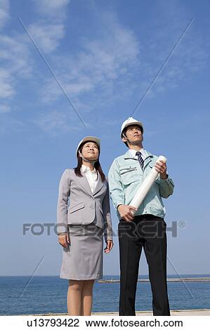 Two Businesspeople at Construction Site View Large Photo Image Stock Image - Two Businesspeople at Construction Site. Fotosearch