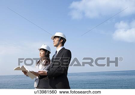Two Businesspeople at Construction Site View Large Photo Image Stock Image - Two Businesspeople at Construction Site. Fotosearch