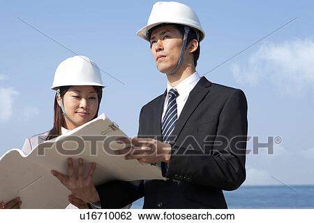Two Businesspeople at Construction Site View Large Photo Image Stock Image - Two Businesspeople at Construction Site. Fotosearch