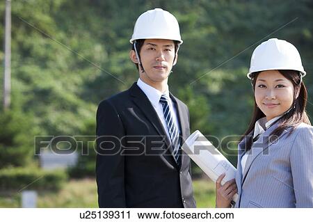 Two Businesspeople at Construction Site View Large Photo Image Stock Image - Two Businesspeople at Construction Site. Fotosearch