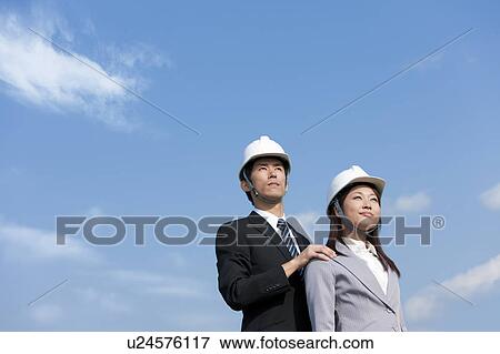 Stock Photo - Two Businesspeople at Construction Site. Fotosearch