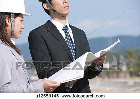 Two Businesspeople at Construction Site View Large Photo Image Stock Photography - Two Businesspeople at Construction Site. Fotosearch