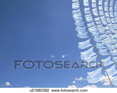 White flags fluttering in the wind View Large Photo Image Stock Image - White flags fluttering in the wind. Fotosearch