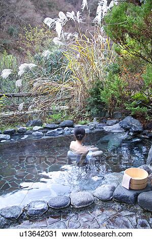 Stock Image - Woman in hot spring. Fotosearch