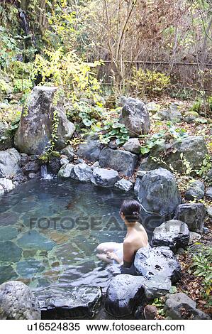 Stock Photography - Woman in hot spring. Fotosearch