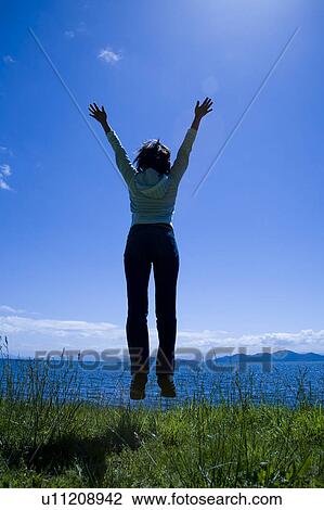 Woman Jumping View Large Photo Image Stock Image - Woman Jumping. Fotosearch