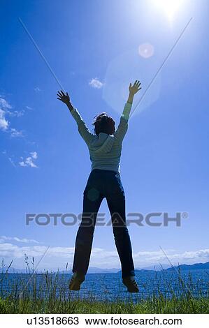 Woman Jumping View Large Photo Image Stock Image - Woman Jumping. Fotosearch