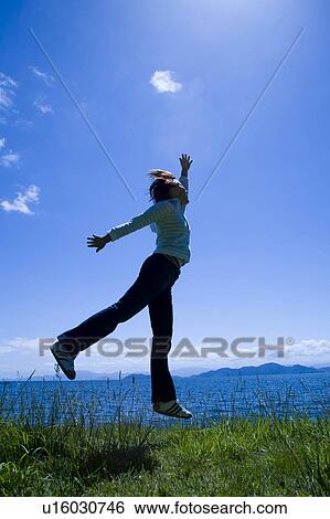 Woman Jumping View Large Photo Image Stock Photograph - Woman Jumping. Fotosearch