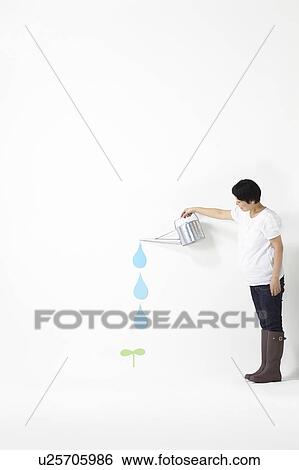 Stock Photograph - Woman Watering Plant. Fotosearch
