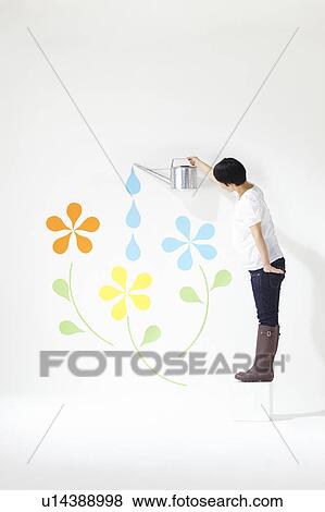 Stock Photo - Woman Watering Plants. Fotosearch