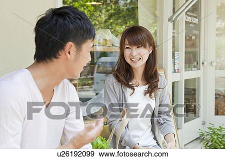 Stock Photo - Young couple at a cafe. Fotosearch