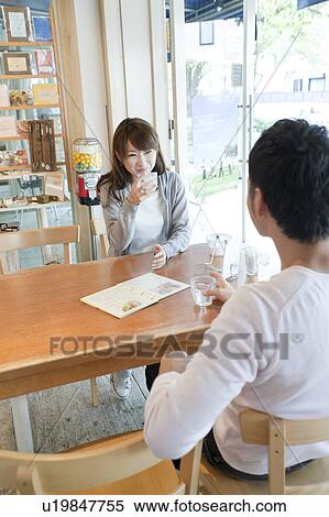 Young couple at a cafe View Large Photo Image Stock Photography - Young couple at a cafe. Fotosearch